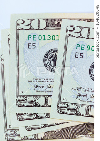 Showcases front side twenty dollar bill, featuring United States of America Banknotes with its distinctive design. Showcases front side twenty dollar bill, featuring United States of America Banknotes with its distinctive design. 104620648