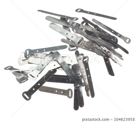 Aluminum electric wire cable clip to wrap electricity cable in house and arrange in order. Aluminum electric wire cable clip is new one and close up, white background isolated Aluminum electric wire cable clip to wrap electricity cable in house and arrange in order. Aluminum electric wire cable clip is new one and close up, white background isolated 104623958