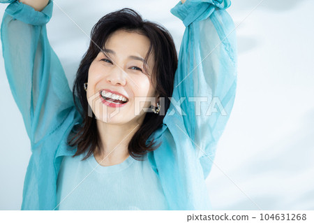 middle lady in aqua blue shirt 104631268