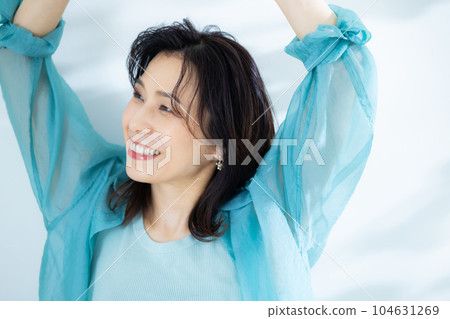 middle lady in aqua blue shirt 104631269