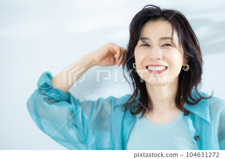 middle lady in aqua blue shirt 104631272