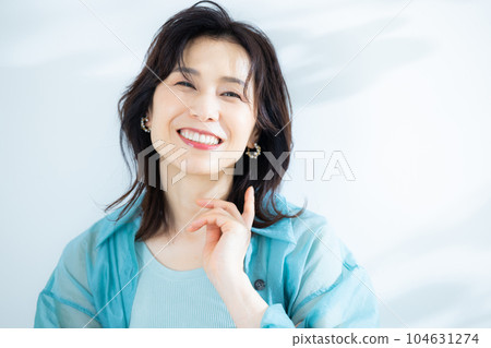 middle lady in aqua blue shirt middle lady in aqua blue shirt 104631274