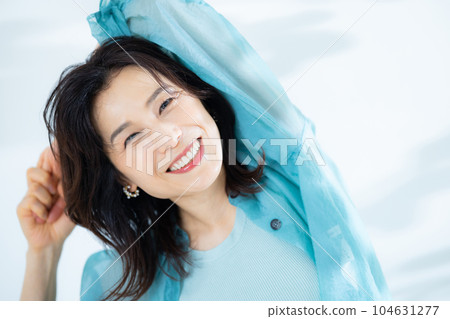 middle lady in aqua blue shirt 104631277