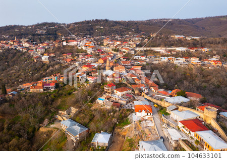 Aerial view of Georgian town of Sighnaghi on steep hill in spring Aerial view of Georgian town of Sighnaghi on steep hill in spring 104633101