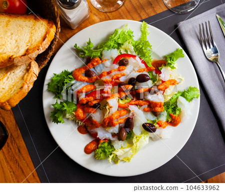 Traditional catalan salad Xatonada with crumbled cod Traditional catalan salad Xatonada with crumbled cod 104633962