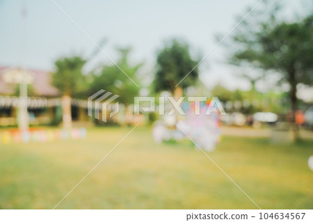 Defocused bokeh and blur background of garden trees in sunlight with vintage toned. Defocused bokeh and blur background of garden trees in sunlight with vintage toned. 104634567