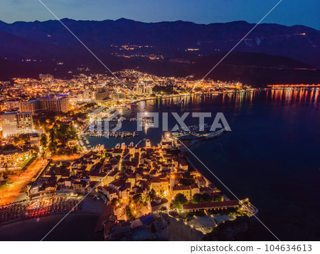 Budva city lights from Montenegro seen from above. Night view. Drone old town Budva at night 104634613