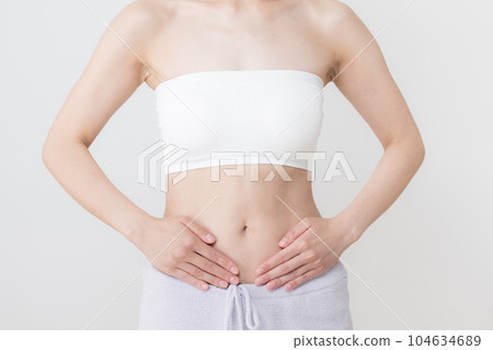 Place your hands around your waist and abdomen 104634689