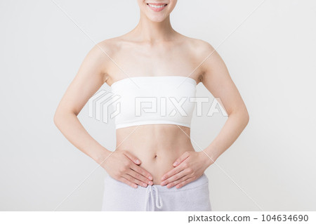Place your hands around your waist and abdomen Place your hands around your waist and abdomen 104634690
