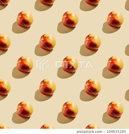 Pattern of apples on a beige background. Pattern of apples on a beige background. 104635285
