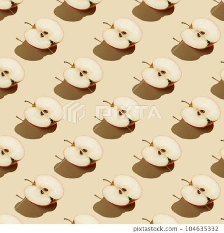 Pattern of apples on a beige background. 104635332