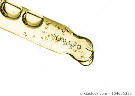 Transparent pipette with cosmetics on a light background. 104635333