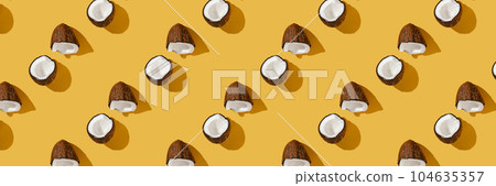 A pattern of coconuts on a bright yellow background. 104635357
