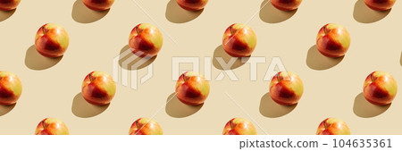 Pattern of apples on a beige background. Pattern of apples on a beige background. 104635361