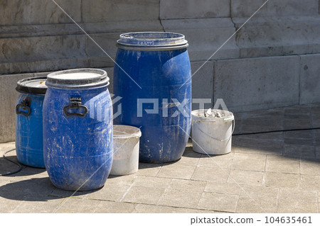 Barrels and buckets with repair and construction materials 104635461