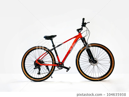 Red mountain bike isolated on white background. Red mountain bike isolated on white background. 104635938