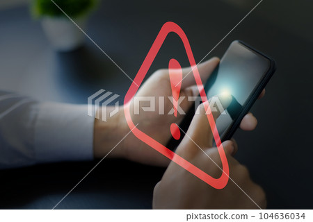 Smartphone and red hazard warning. 104636034