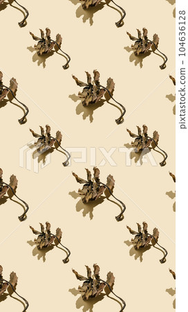 Dried leaves on a beige background. Autumn background. Dried leaves on a beige background. Autumn background. 104636128