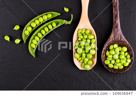 Sugar snap peas with mint on a rustic wood background 104636847