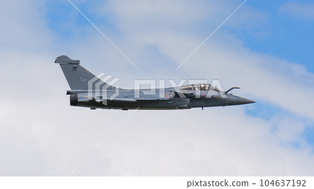French Air Force Rafale fighter above the clouds 104637192