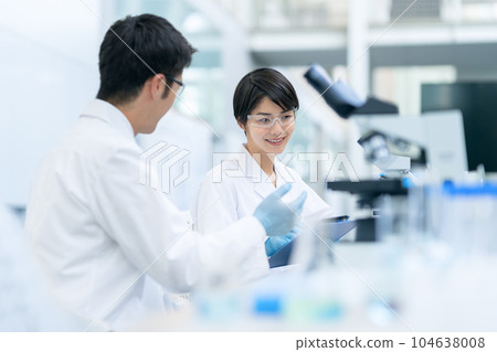 Researchers having a meeting at the laboratory 104638008