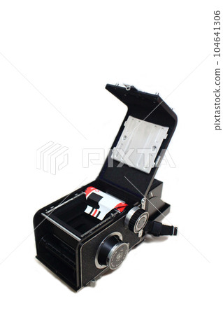 Film mounted on antique twin-lens reflex camera White background Film mounted on antique twin-lens reflex camera White background 104641306