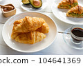 Croissant with egg,avocado on white dish and honey, coffee. breakfast and healthy food concept.. 104641369