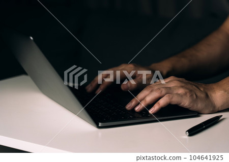 Close up hand using laptop computer on desk. Close up hand using laptop computer on desk. 104641925