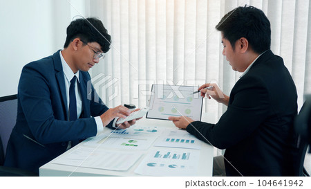Teamwork with business people analysis cost graph on desk at meeting room. 104641942