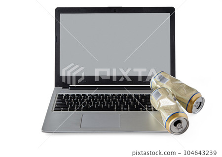 Empty crumpled aluminum beer cans and laptop isolated on white background. Drunk brawls on social media and a flooded keyboard Empty crumpled aluminum beer cans and laptop isolated on white background. Drunk brawls on social media and a flooded keyboard 104643239
