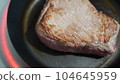 Beef steak under cooking 104645959