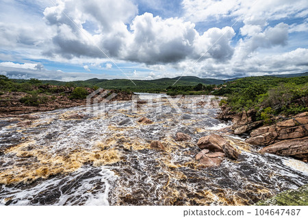 Donana Waterfall in Paraguassu River with dark waters in Andarai, Chapada Diamantina, Bahia in Brazil 104647487