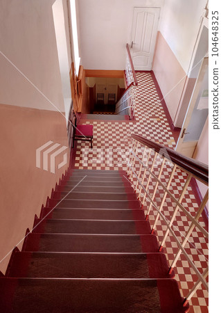 Old steel staircase in a local  hospital in historic part in Ukraine 104648325