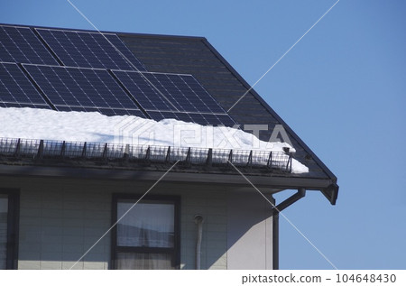 Roof snow guard with solar panels 104648430