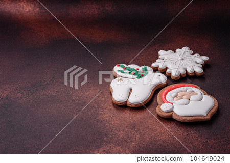Beautiful delicious Christmas gingerbread on a concrete texture background 104649024