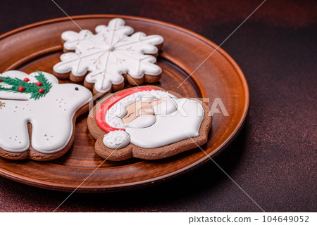 Beautiful delicious Christmas gingerbread on a concrete texture background 104649052