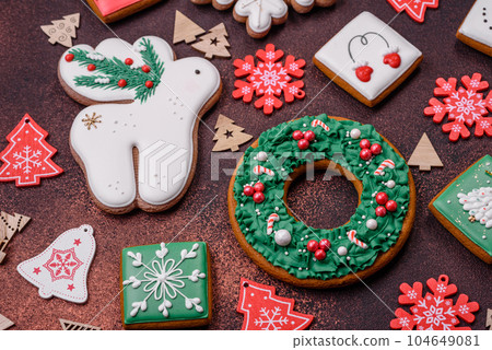 Beautiful delicious Christmas gingerbread on a concrete texture background 104649081