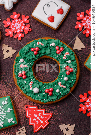 Beautiful delicious Christmas gingerbread on a concrete texture background 104649084