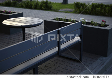 Spring gazebo in the city. A table in a cafe in summer. Spring gazebo in the city. A table in a cafe in summer. 104649113