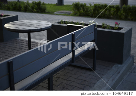 Spring gazebo in the city. A table in a cafe in summer. 104649117