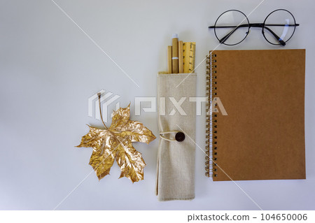 Recycled stationery is laid out on the table. 104650006