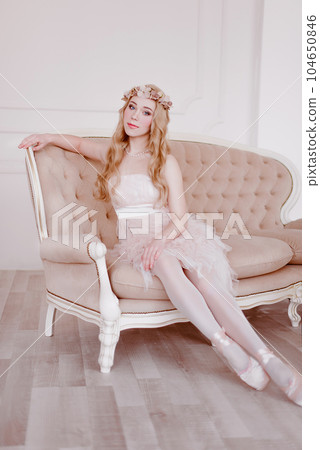 picture of young blonde woman wearing wreath of flowers, spring tender and romantic portrait, fashion retouched shot picture of young blonde woman wearing wreath of flowers, spring tender and romantic portrait, fashion retouched shot 104650846