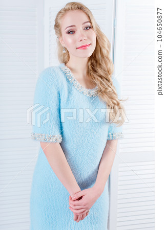 Young and emotional girl in fashion blue dress over glamour background. Kid's and fun Young and emotional girl in fashion blue dress over glamour background. Kid's and fun 104650877