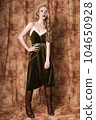 Beautiful fashion model in a velvet green dress. Vintage. Luxury style. 104650928