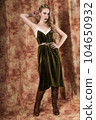 Beautiful fashion model in a velvet green dress. Vintage. Luxury style. 104650932