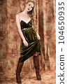 Beautiful fashion model in a velvet green dress. Vintage. Luxury style. 104650935