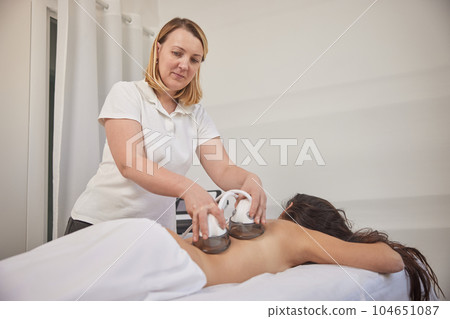 massage procedure, Fighting overweight, professional equipment. Following massage procedures in salon vacuum-vacuum body massages, problem areas slimming, body care professional equipment, lpg massage 104651087