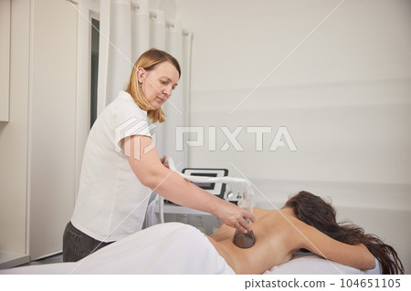 Problem areas, massage procedure, Doctor cosmetologist. Body massage with vacuum, problem areas slimming, body care professional equipment, low ph massage procedure, anti-cellulite roller vacuum 104651105