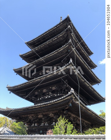 Five-storied pagoda shining in the blue sky Five-storied pagoda shining in the blue sky 104651984