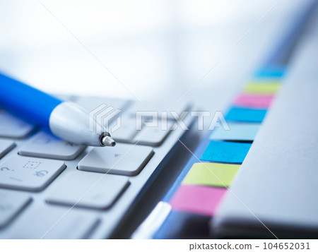 Binders and documents on the table, keyboard Binders and documents on the table, keyboard 104652031
